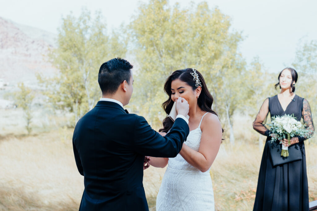 Bride tearing up during ceremony at Red Rock Canyon