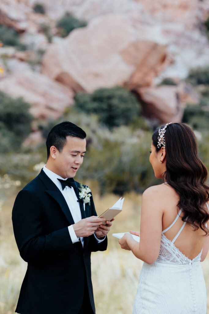 Groom reading vows at Red Rock Canyon