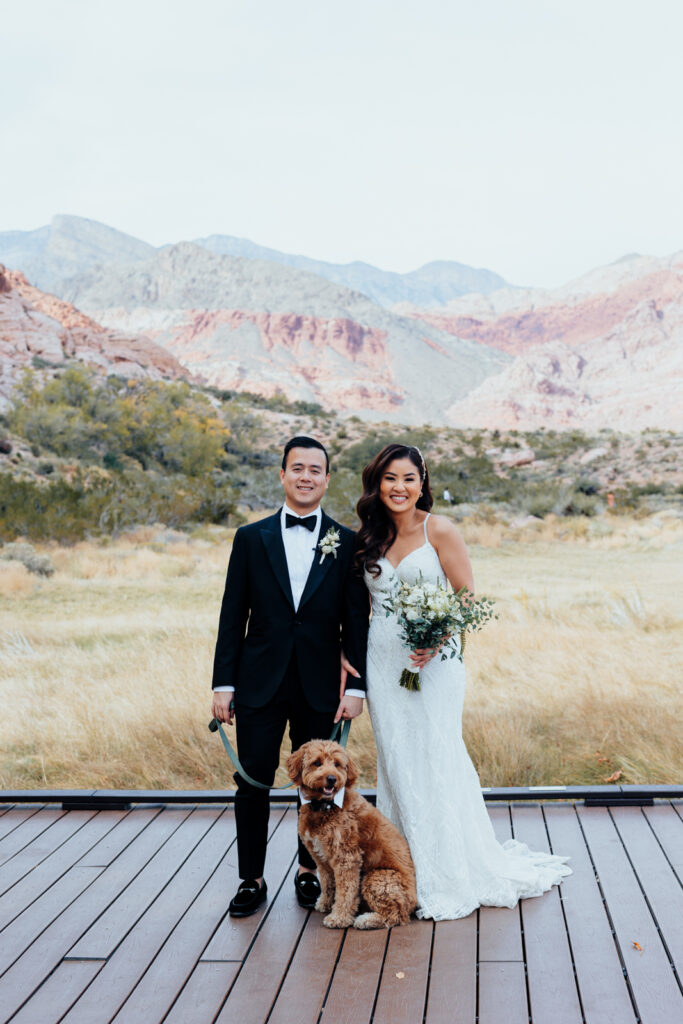 Just married couple at Red spring boardwalk with their dog