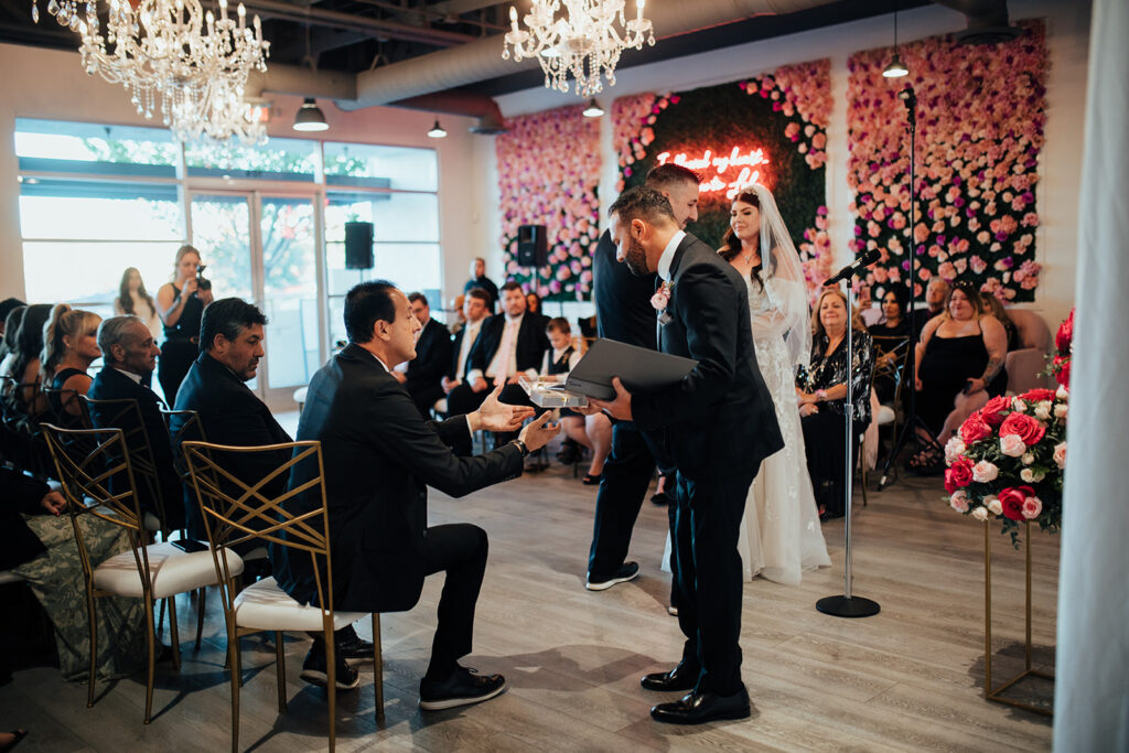 ring exchange during the ceremony at Cafe Lola