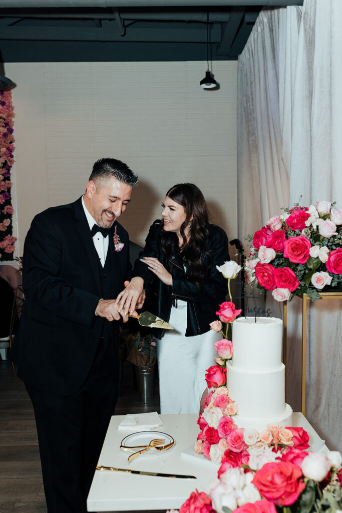 Couple cutting cake at wedding venue in Las Vegas