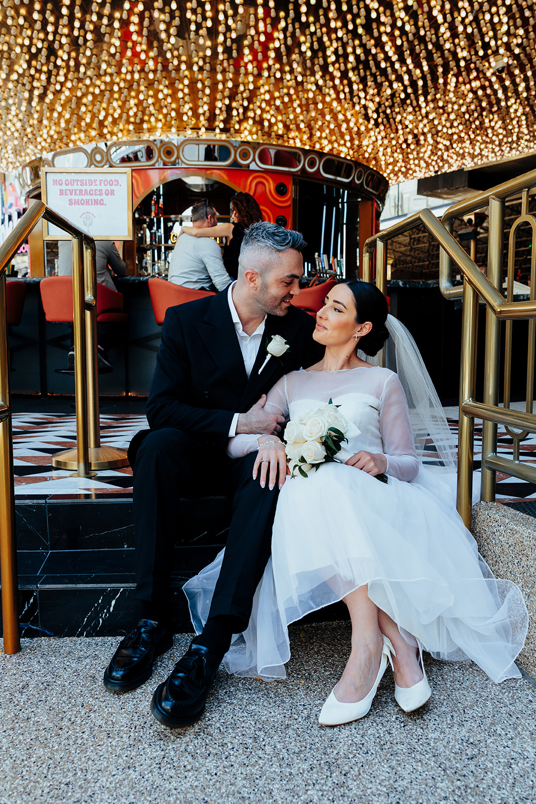 Bride and Groom Embracing on Wedding Day at Plaza Hotel in Downtown Las Vegas