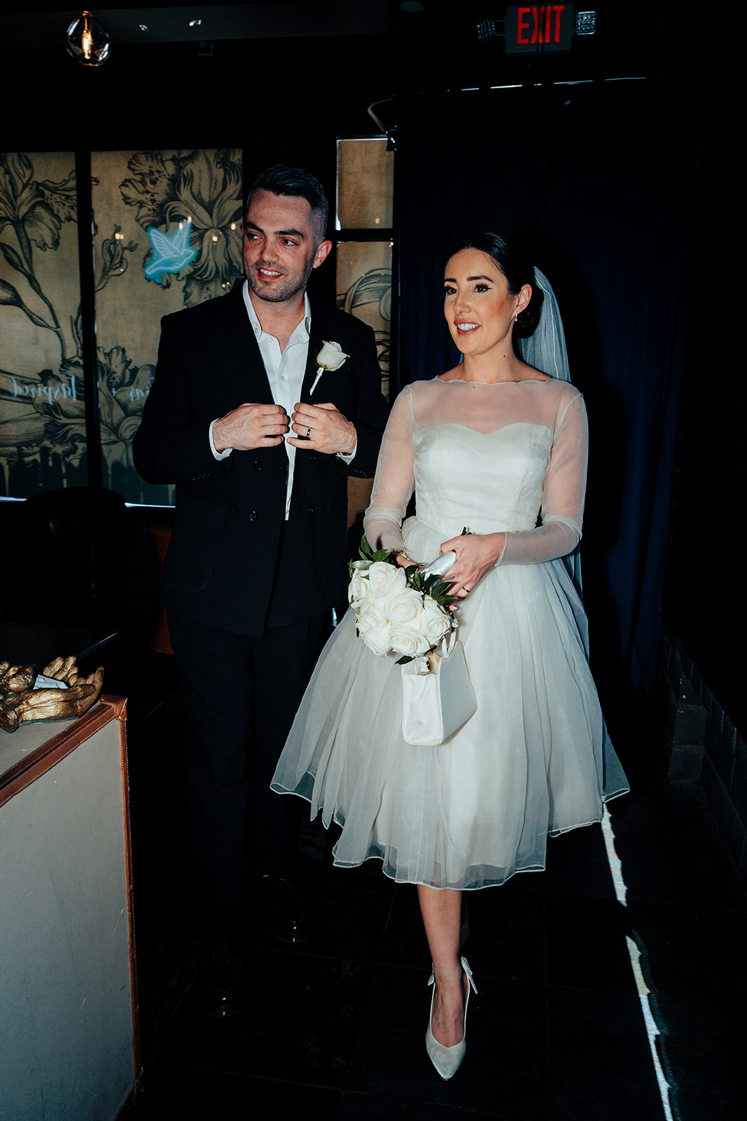 Newlyweds smiling as they enter Sparrow and Wolf in Las Vegas