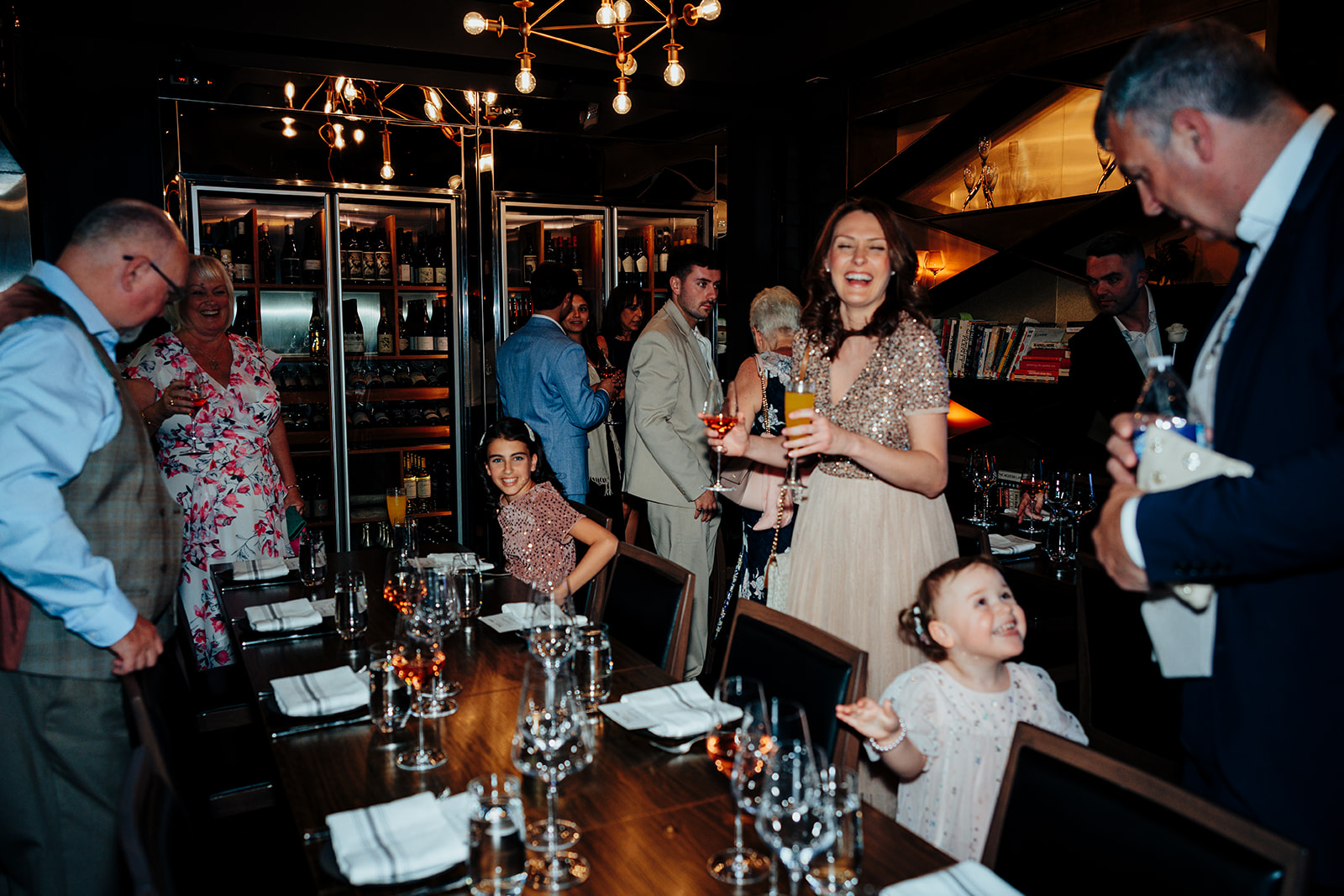 Wedding guests laughing and mingling at Las Vegas reception dinner