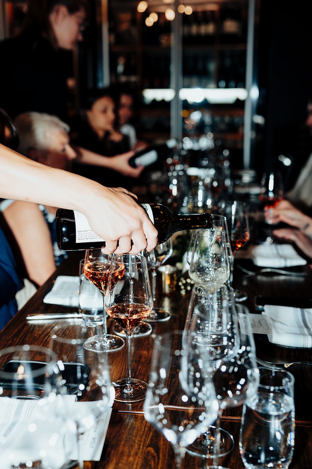 Server pouring wine for guests at a Las Vegas wedding reception