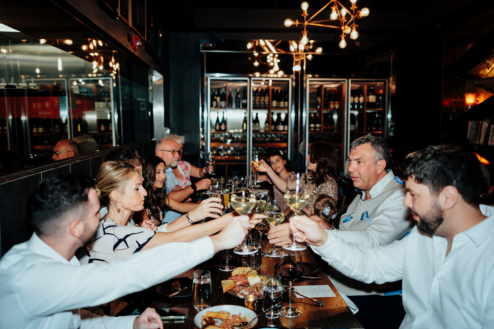 Guests clinking glasses during wedding reception dinner in Las Vegas