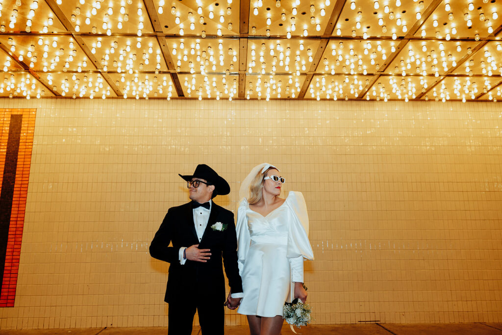 Playful Newlyweds Celebrating a Las Vegas Elopement at Night