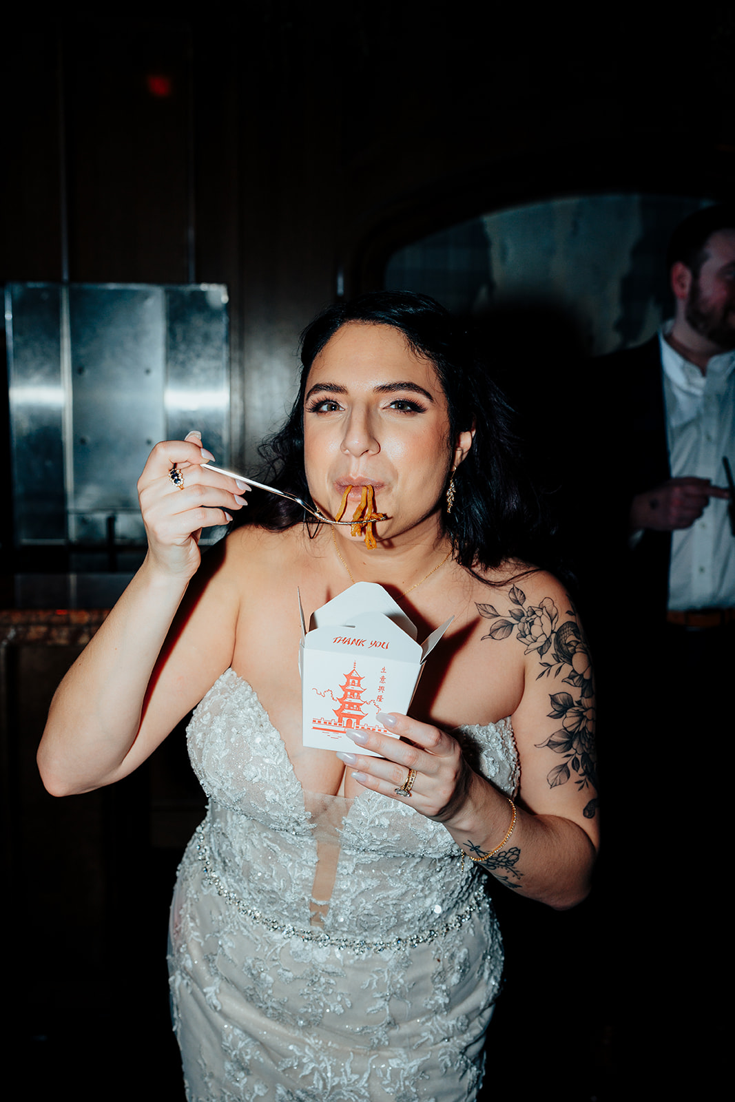 Bride Eating Noodles in Wedding Dress