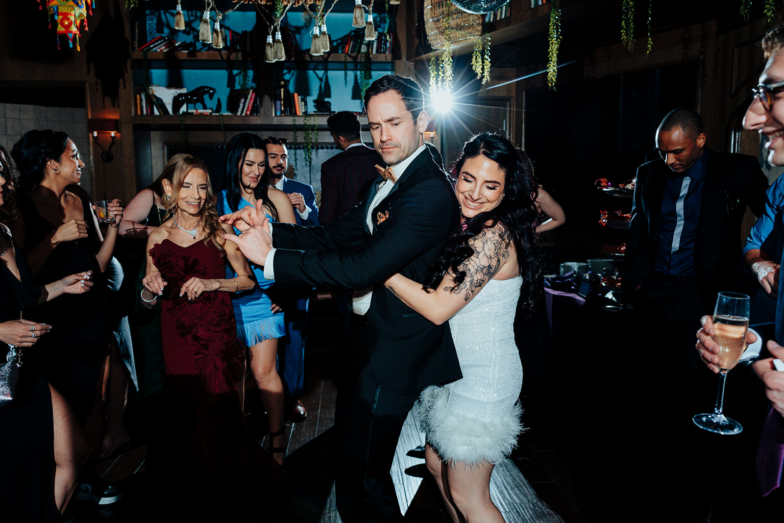 Bride and Groom Dancing Joyfully with Guests