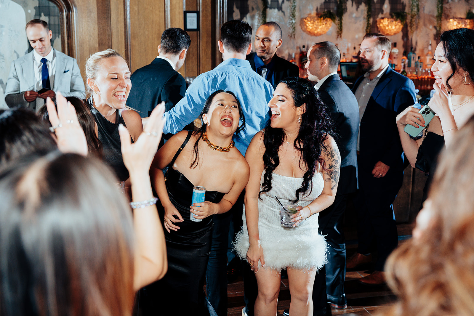 Wedding Guests Sharing Laughter During Festive Celebration