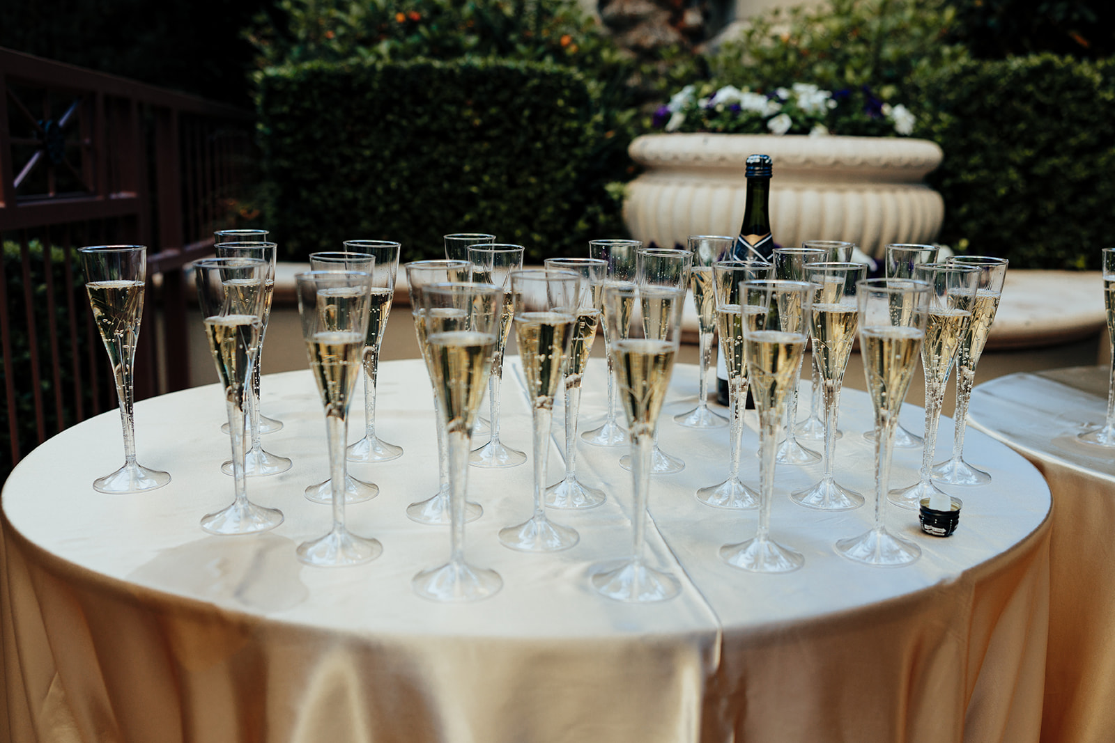 Close-Up of Champagne Glasses on Gold Tablecloth at Wedding