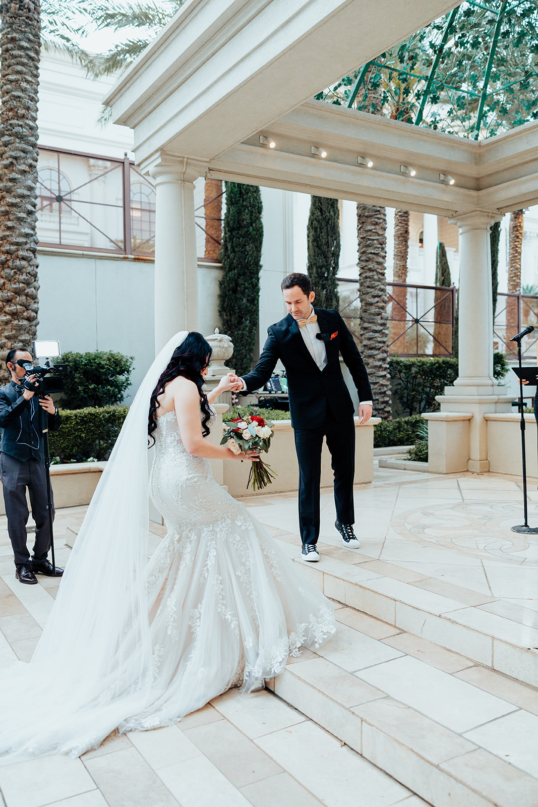 Groom Helping Bride at Caesars Palace Ceremony