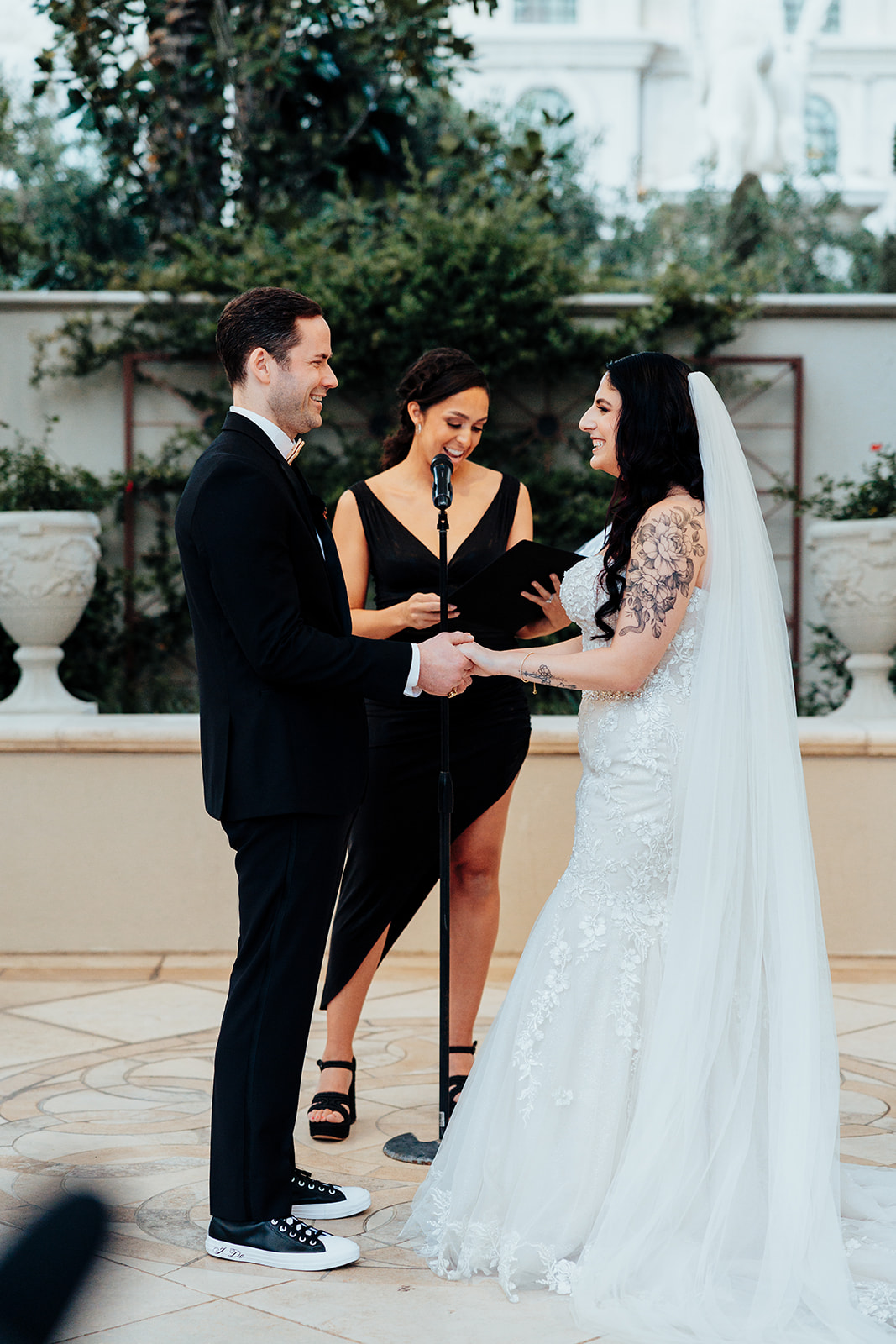 Bride and Groom Holding Hands During Wedding Ceremony