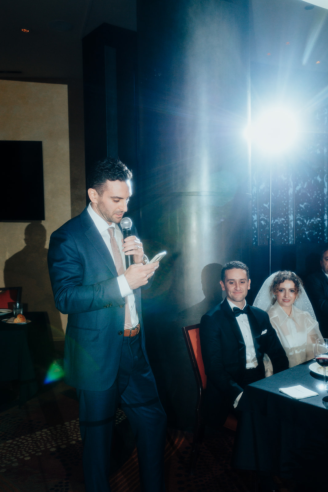 A Groomsman with a Microphone speaking at a Las Vegas Wedding Reception