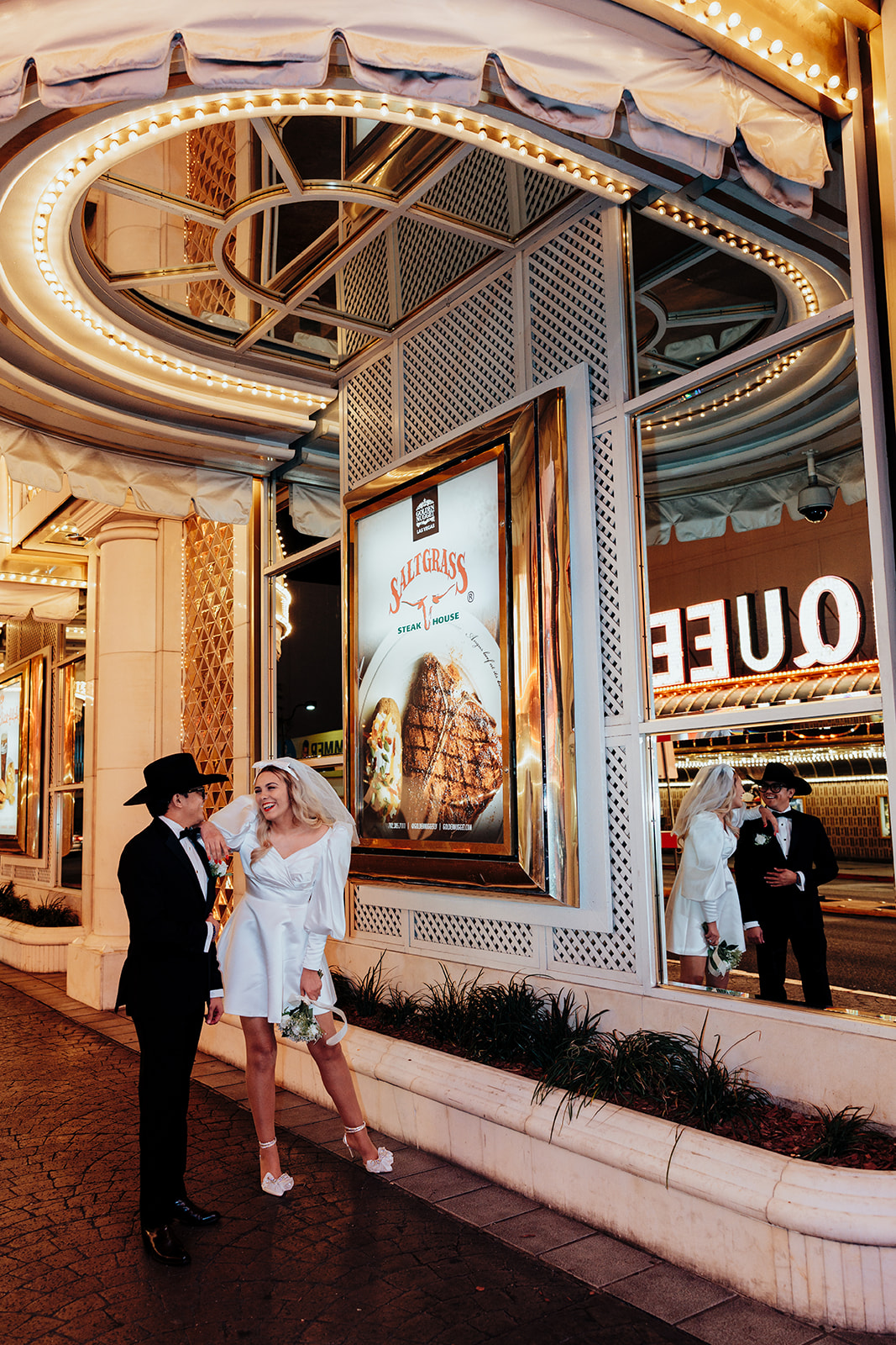 Bride and Groom Sharing a Moment Under Neon Lights