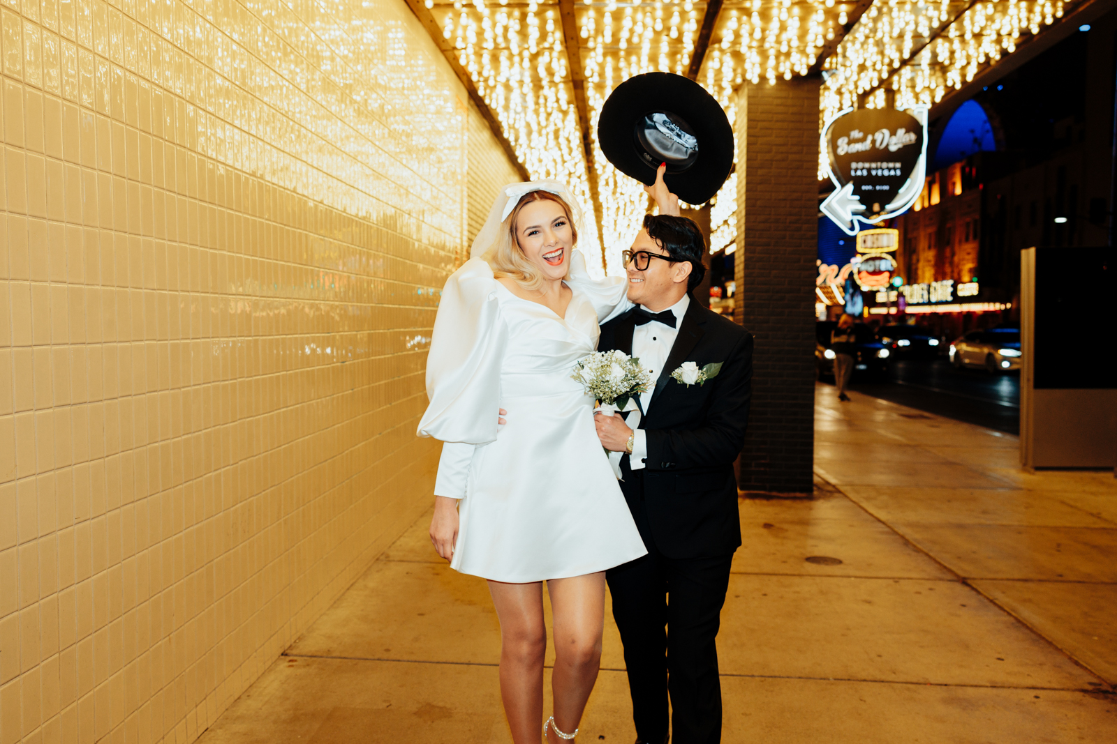 Newlyweds Celebrating Their Elopement on a Vegas Street