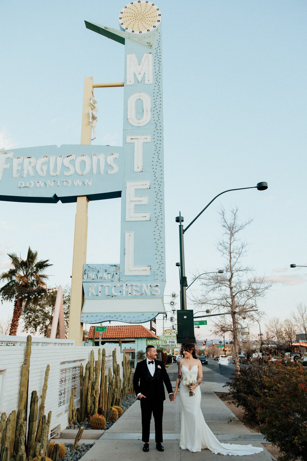 Wedding Couple Under The Furguson's Motel Sign in Las Vegas