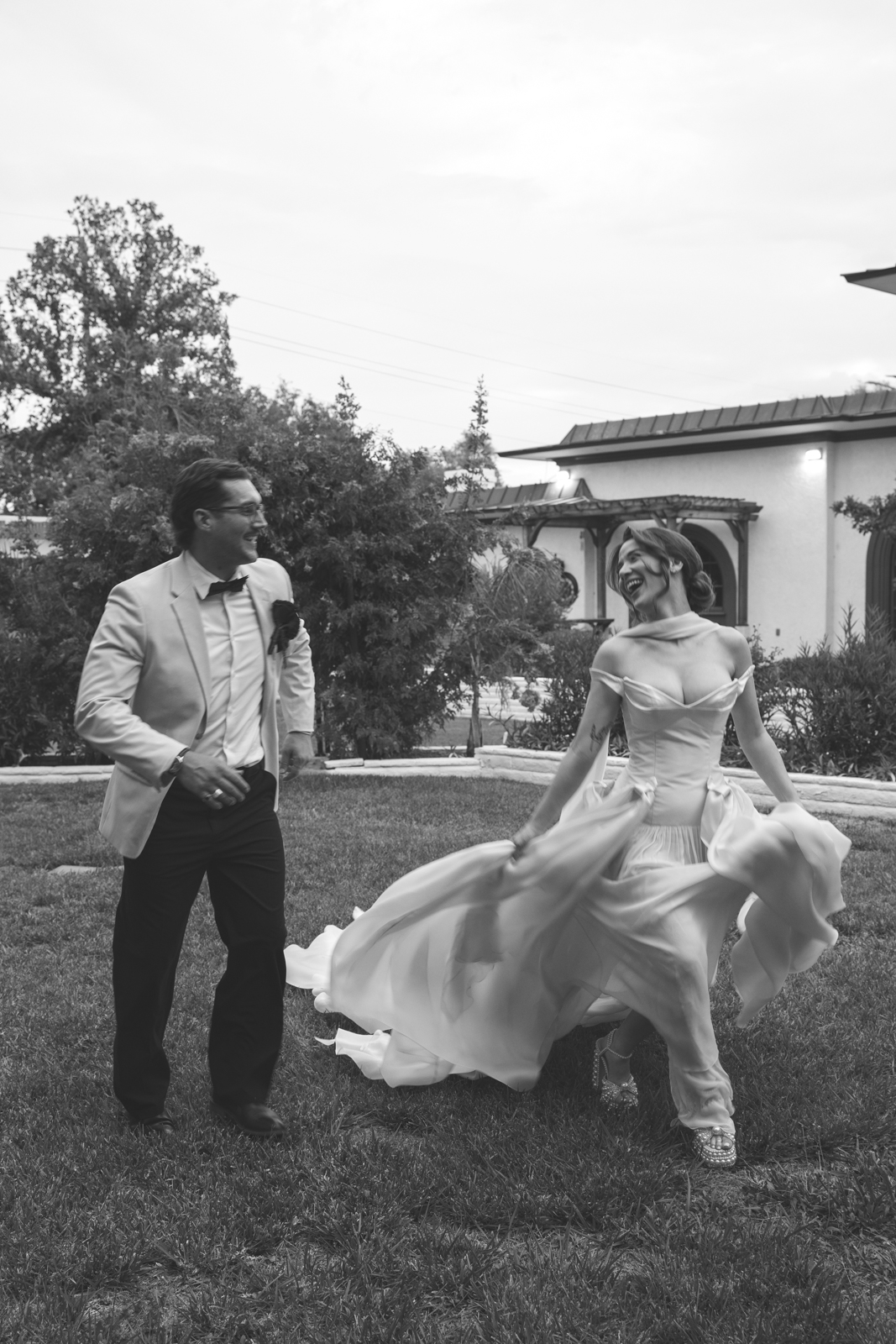 couple running in the grass at Desert Inn Oasis