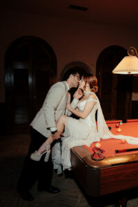 Bride and Groom on pool table night time photos